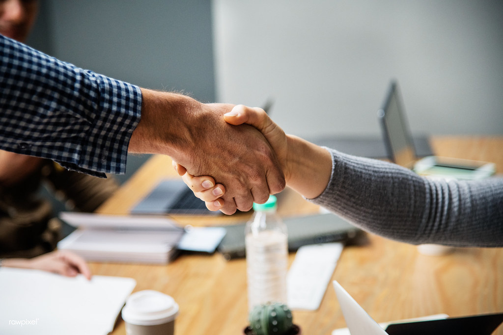 Business people shaking hands in agreement